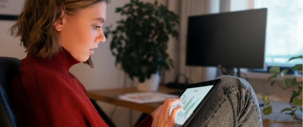 Person using AI health tool on tablet in a modern European home environment in 2026